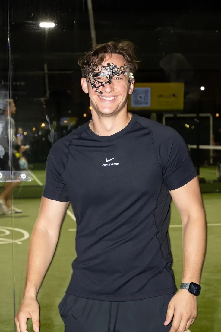 A guest wearing a Halloween mask